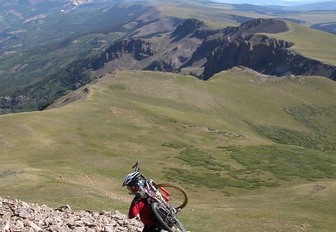 Aug 12 03 Spring Creek Pass - Rio Grande Reservoir;
Ned carrying the bike to 13K - rode that ridge you see